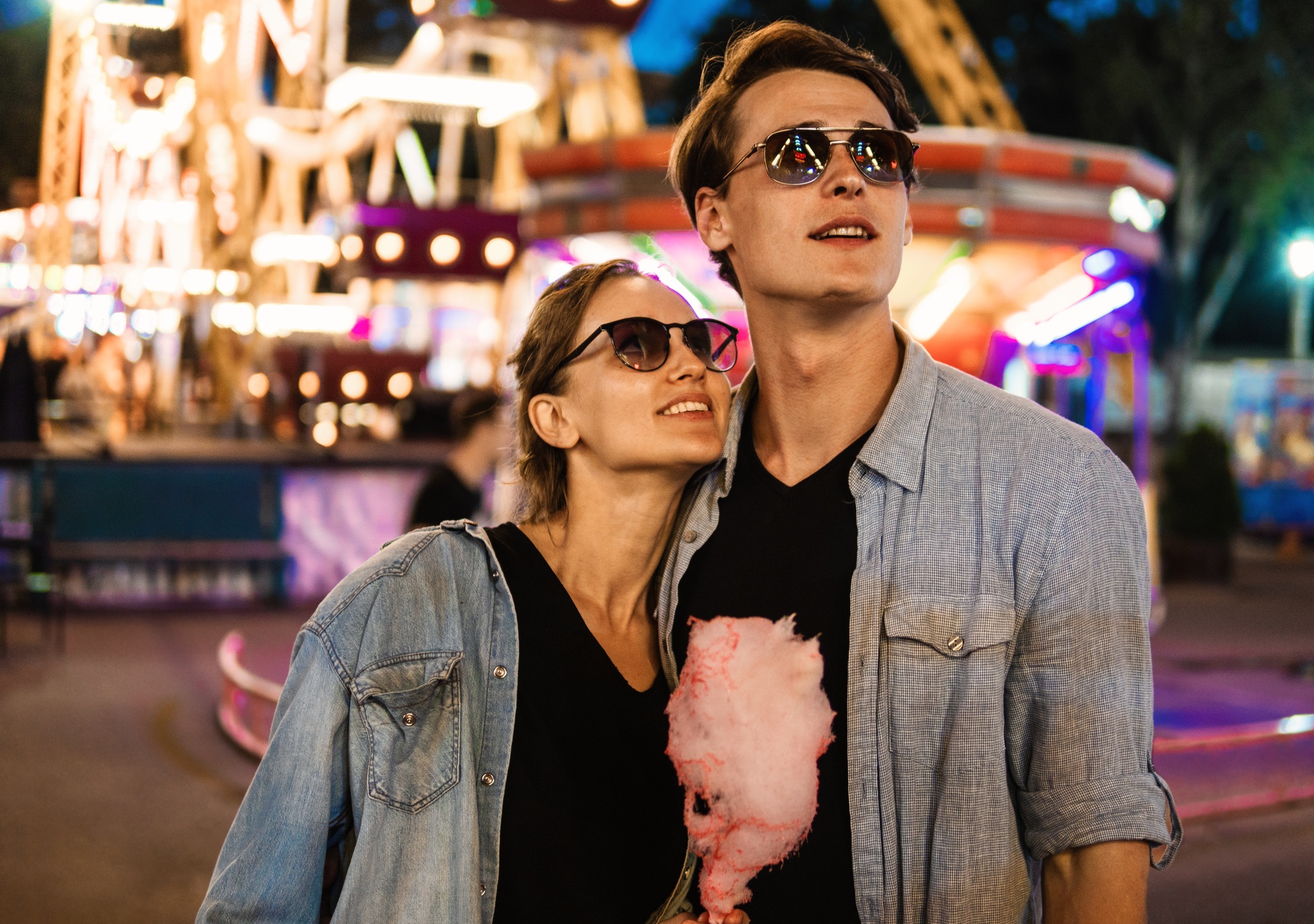 Lovely young hipster couple dating during summer sunset