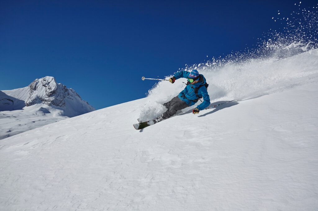 Male freestyle skier skiing down mountainside, Zugspitze, Bayern, Germany