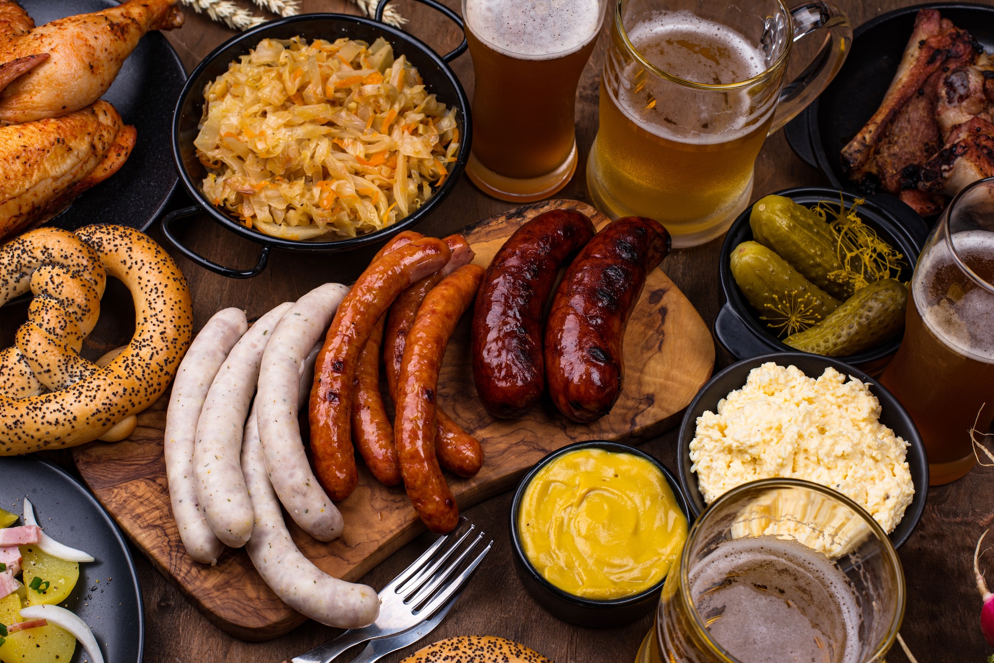 Oktoberfest dishes with beer, pretzel and sausage